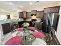 Modern kitchen with stainless steel appliances, granite countertops, and a breakfast nook at 303 Fortress Dr, Morrisville, NC 27560