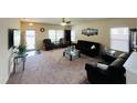 Bright and airy living room featuring neutral tones and large windows at 303 Fortress Dr, Morrisville, NC 27560