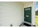 Welcoming front door with decorative window and stylish address plate at 3615 Ramblewood Ave, Durham, NC 27713