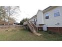 This backyard has a wooden deck and a view of the home's exterior at 392 Travel Lite Dr, Raleigh, NC 27603