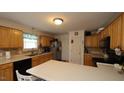 Traditional kitchen featuring wood cabinets and a functional layout at 392 Travel Lite Dr, Raleigh, NC 27603