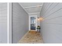 Inviting entrance featuring a welcome mat and gray wood paneled walls at 4631 Timbermill Ct # 301, Raleigh, NC 27612