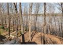 A beautiful backyard deck overlooking the trees with a lake view at 4808 Clubview Ct, Fuquay Varina, NC 27526