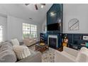 Inviting living room with a vaulted ceiling, fireplace, built-in shelving, and comfortable seating at 717 Maple Brook Rd, Fuquay Varina, NC 27526