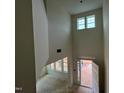 Bright foyer featuring soaring ceilings, large windows, and an open doorway leading outside at 789 Old Station Pointe, Angier, NC 27501