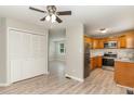 Open concept kitchen featuring stainless appliances and light wood cabinets, connecting to dining area at 820 Newcombe Rd, Raleigh, NC 27610