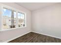 Bright room featuring new flooring and a light-filled window showing a view of the surrounding landscape at 105 Pisgah St, Sanford, NC 27330