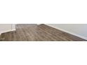 Spacious room featuring beautiful new flooring and clean trim at 105 Pisgah St, Sanford, NC 27330