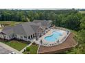 Aerial view of community pool with ample lounge seating and meticulously maintained landscaping at 1131 Pate Farm Ln, Durham, NC 27703