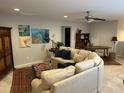 Comfortable living room with neutral tones, decorative rugs, and unique artwork at 12409 Angel Vale Pl, Durham, NC 27703