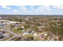 A sprawling aerial view of the neighborhood showcasing the trees, rooftops and roadways at 1721 Raleigh Rd, Henderson, NC 27536