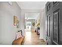 Inviting foyer features wood floors, neutral walls, and a view into the open-concept living area at 199 Pretty Run Branch Lane, Wendell, NC 27591