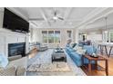 Inviting living room with fireplace, coffered ceiling, and abundant natural light at 3 Alumwood Pl, Durham, NC 27705