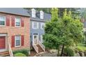Townhouse featuring blue siding, dormer windows, and a welcoming front entrance at 3111 Coachmans Way, Durham, NC 27705