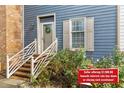 Charming home entrance with brick stairs and blue siding at 3111 Coachmans Way, Durham, NC 27705