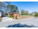 Inviting single-story brick home with a lush front lawn and a freshly paved driveway at 412 Suburb St, Rocky Mount, NC 27801