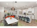 Open concept living area with a kitchen island, dining table and furniture in the living room at 609 Rawls Dr, Raleigh, NC 27610