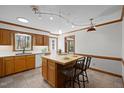 Traditional kitchen with a center island, wooden cabinetry, and tile flooring at 8429 Bells Lake Rd, Apex, NC 27539