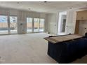 Spacious unfinished living room with large windows allowing natural light at 902 Norwood Ln, Apex, NC 27502