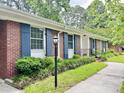 Classic brick facade accented with blue shutters and manicured landscaping enhancing the curb appeal at 914 S Crescent Dr, Smithfield, NC 27577