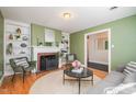 Inviting living room features a fireplace, built-in shelving, and hardwood floors at 914 S Crescent Dr, Smithfield, NC 27577