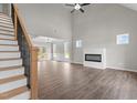 Spacious living room with high ceilings, fireplace, wood floors and ample natural light creating a warm atmosphere at 9353 Turkey Way, Middlesex, NC 27557
