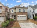 Inviting two-story home featuring stone accents and a two-car garage on a sunny day at 105 Concordia Woods Dr, Morrisville, NC 27560
