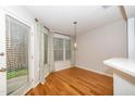 Bright dining area with hardwood floors, large windows and modern light fixture at 109 Killam Ct # La, Cary, NC 27513