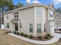 Charming home showcasing well-maintained landscaping, multiple windows, and welcoming entrance at 1103 Apogee Dr, Durham, NC 27713