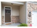 Close-up of front entry shows stone accents and craftsman style door at 1123 Latitude Dr, Durham, NC 27713