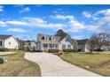 Quaint single-Gathering home with a long driveway and a well-kept lawn in a quiet neighborhood at 147 Tralee Dr, Smithfield, NC 27577
