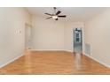 Spacious living room with ceiling fan and wood floors leads to other areas of the home at 1603 Stonegate S, Sanford, NC 27332