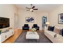 Cozy living room with plush seating, stylish decor, and a view into adjacent room at 1603 Stonegate S, Sanford, NC 27332
