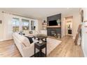 Bright living room with fireplace, mantel, and large windows with lots of natural light at 197 S Clearbook Ct, Angier, NC 27501
