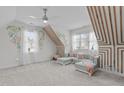 Upstairs bonus room with natural light and stylish decorative accents at 3608 Hillthorn Ln, Apex, NC 27539