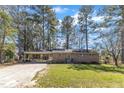 Charming brick home featuring a covered carport and front yard at 417 Baker St, Nashville, NC 27856