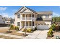 Stunning two-story home with double porch, attached garage, and well-maintained landscaping at 518 Parlier Dr # 82, Apex, NC 27523