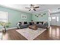 Inviting living room with hardwood floors, neutral paint, stylish sofas, and a bright, airy feel at 52 Reserve Dr, Fuquay Varina, NC 27526