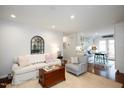 Cozy living room featuring hardwood floors, comfortable seating and neutral décor at 528 Moseley Ln, Raleigh, NC 27601
