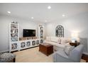 Bright living room boasts neutral tones, built-in shelving, and comfortable seating at 528 Moseley Ln, Raleigh, NC 27601