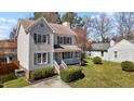 Beautiful home with a well-maintained lawn and classic architectural details at 5313 Wenesly Ct, Raleigh, NC 27616