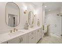 Bright bathroom with double vanity, quartz countertops, gold hardware, and tiled walk-in shower at 56 Mist Wood Ct, Pittsboro, NC 27312
