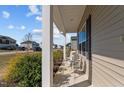 Comfortable front porch setting with two chairs offering a peaceful outdoor space at 80 Westbrook Ln, Franklinton, NC 27525