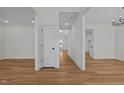 Hallway with wood flooring and white walls providing access to the rest of the home at 109 Little Lady Trail, Zebulon, NC 27597