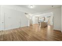 Expansive living room with new flooring, neutral walls, and easy access to the kitchen and staircase at 116 Polaris Ave, Garner, NC 27529