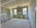 Unfinished bedroom with two windows and closet space at 163 Noramac Ct, Selma, NC 27576