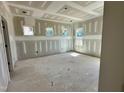 Unfinished living room with lots of natural light and multiple windows at 163 Noramac Ct, Selma, NC 27576