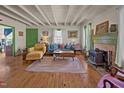 Cozy living room with wood floors, wood burning stove, and neutral walls at 2409 Hodges Rd, Burlington, NC 27217