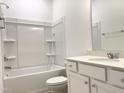 Well-lit full bathroom features tub-shower combination and granite vanity at 283 Golfview Avenue, Benson, NC 27504