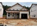 New construction home featuring an attached garage and a landscaped yard still in progress at 346 Bluejay St, Clayton, NC 27520